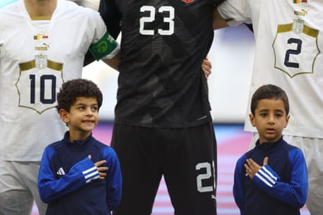 Young mascots line up during the national anthems in front of Serbia's Dusan Tadic, Vanja Milinkovic-Savic and Strahinja Pavlovic.