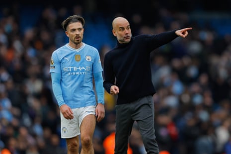 Pep Guardiola instructs Jack Grealish after the match.