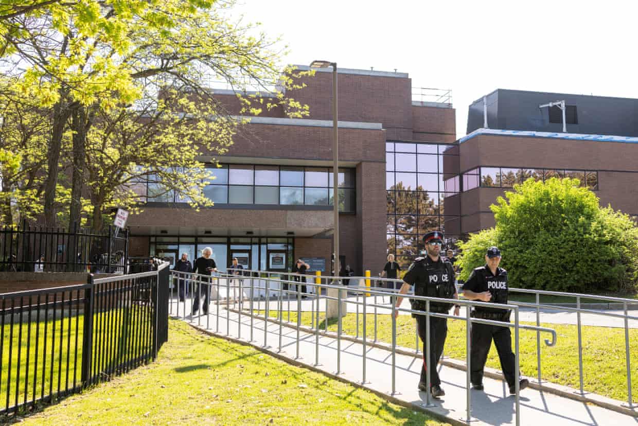Police officers outside the court on Friday before Law’s appearance.