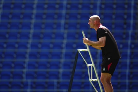 England head coach Steve Borthwick climbs a ladder to observe a training session at Hill Dickinson Stadium