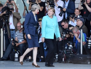 theresa may visits angela merkel in