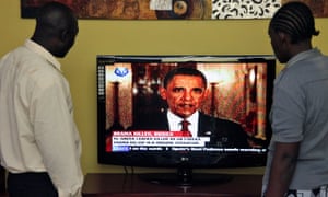 Kenyans watch Barack Obama on television in Nairobi, 2011.