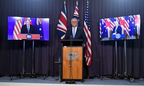 Scott Morrison announces the AUKUS pact and nuclear submarine deal in Canberra, with Boris Johnson and Joe Biden on screen for their respective announcements in the UK and US