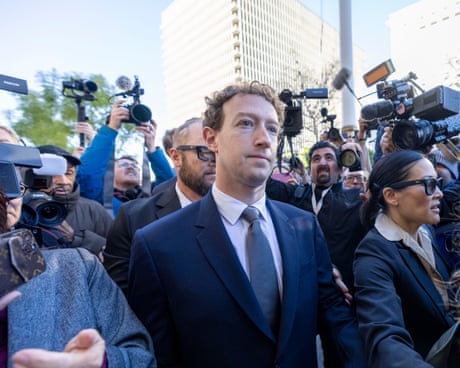 Mark Zuckerberg on a street surrounded by photographers