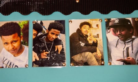 Photographs of the four boys pinned on a wall