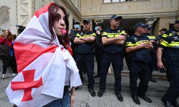 Demonstrators protesting the "foreign influence" law crowd outside the parliament building in central Tbilisi on Tuesday