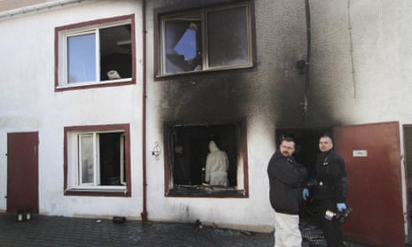 Police examine the site of the escape room in Koszalin where the five girls died in a fire.