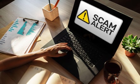 Scam alert detecting warning on a laptop