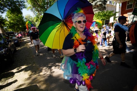 Participants take part in the Pride parade through the streets of downtown Denver, Colorado, on 25 June.