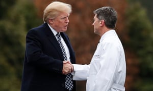 Donald Trump shakes hands with Ronny Jackson