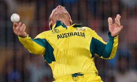 David Warner celebrates after taking a catch to dismiss India's Shreyas Iyer off the bowling of Josh Hazlewood.