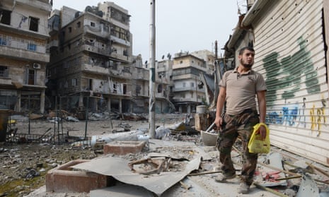 A rebel fighter in the Syrian city of Aleppo after heavy fighting. 
