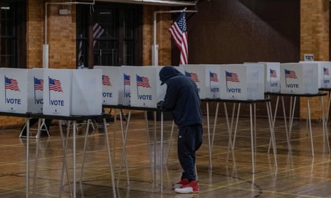 A resident casts his vote on 3 November 2020 in Flint, Michigan.