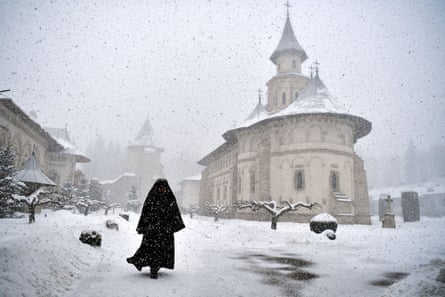 Romanian Orthodox monk Father Mikhail departs after mass at the Church in Putna monastery, Putna, Romania on 8 March