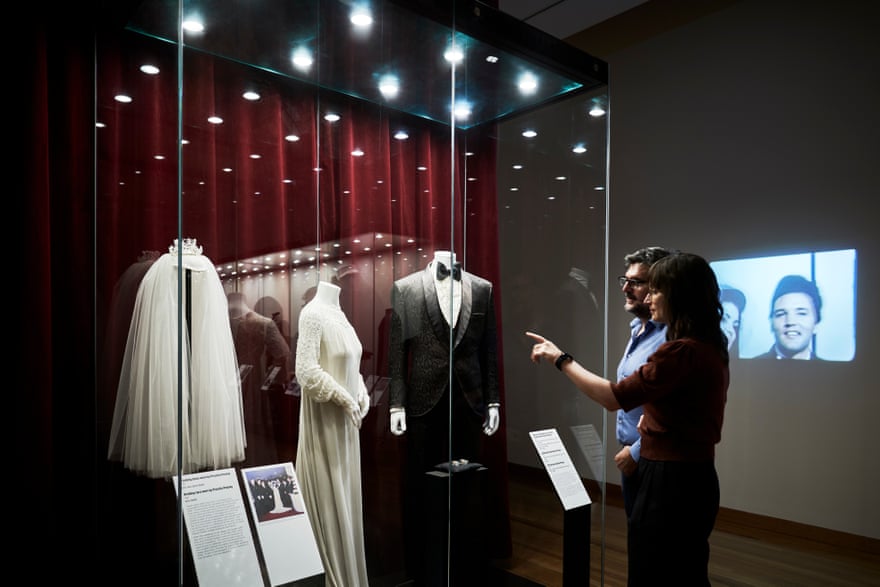 The display case containing Priscilla Presley’s 1967 wedding dress and veil, and Elvis’s brocade tuxedo