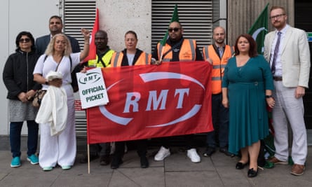 Labour Party MP Kim Johnson (2L) and Labour (Co-op) MP Lloyd Russell-Moyle (1R) join RMT union members at the picket line outside Victoria Station on 21 June, 2022.