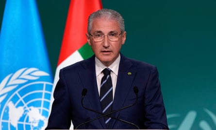 Midshot of a man with a UN and Azerbaijan flag behind