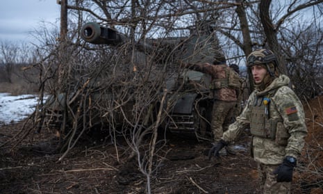 Ukrainian troops prepare to fire a self-propelled howitzer near Bakhmut on Saturday.