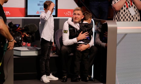 Kyren Wilson breaks down as he is embraced by his sons after triumphing at the Crucible.