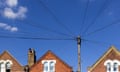 A telegraph pole outside a house