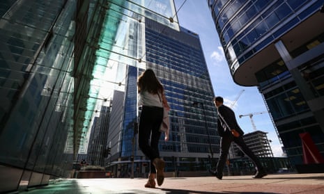 Pedestrians walk past the European Medicines Agency, which employs 900 people in Canary Wharf, London.