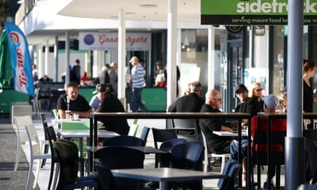 People enjoy outside cafe dining at the Maunganui main beach in Tauranga after restrictions were eased.