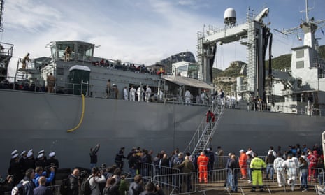 Rescued migrants disembark from the Spanish navy ship Cantabria in Salerno, Italy.