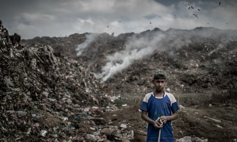 Young scavenger at Dhapa waste dumping ground, Kolkata, India