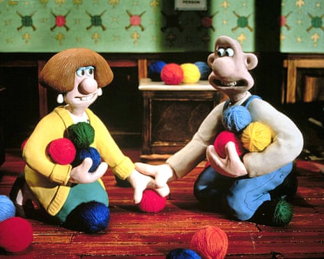 Wallace and Wendolene sit on the floor with balls of wool