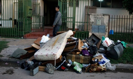 A resident of the Villa Mitre slum and his belongings ruined by the 2013 floods in Buenos Aires.