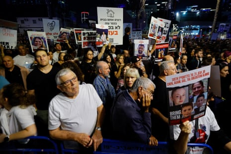People gather as they await news of hostages expected to be released by Hamas, amid a hostages-prisoners swap deal between Hamas and Israel, in Tel Aviv, Israel, November 25, 2023.