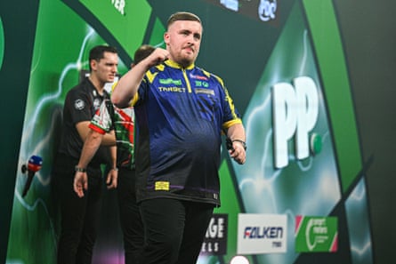 The world champion Luke Littler celebrates winning his second-round match