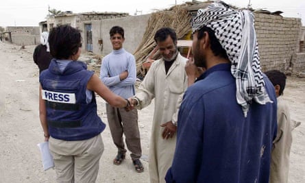 Audrey Gillan talks to villagers in Iraq