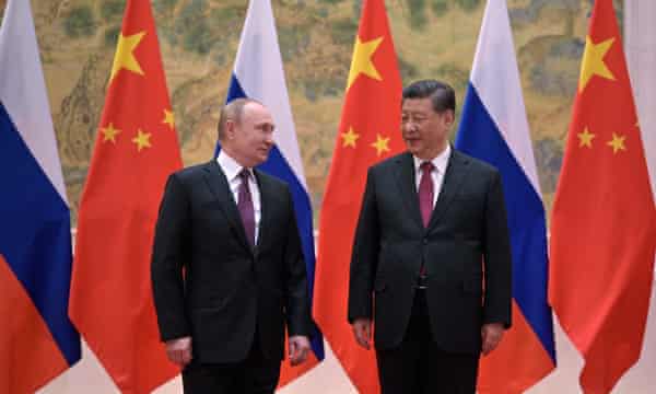 Russian President Vladimir Putin (L) and Chinese President Xi Jinping