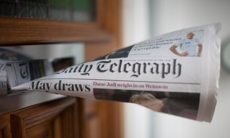 Copy of the Daily Telegraph in a letterbox