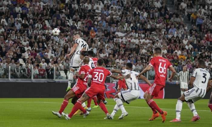 Juventus’ Arkadiusz Milik rises highest to head in the opening goal of the game.