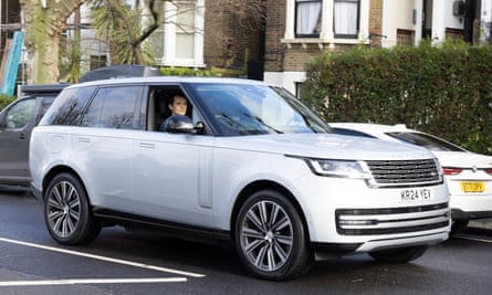 Jasper Jolly driving a silver Range Rover