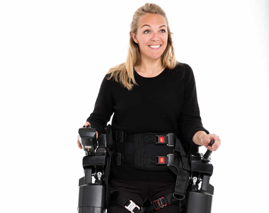 TV presenter Sophie Morgan walking with the aid of Rex, a hands-free robotic walking device.