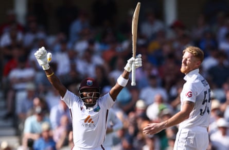 Kavem Hodge celebrates after completing his century at Trent Bridge.