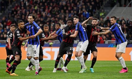 Milan's Divock Origi and Olivier Giroud in action with Inter's Alessandro Bastoni and Francesco Acerbi.