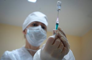 A nurse prepares dose of the Sputnik V Covid-19 vaccine for a patient at a clinic in Moscow as Russia started its vaccination campaign for people aged 60 and over.