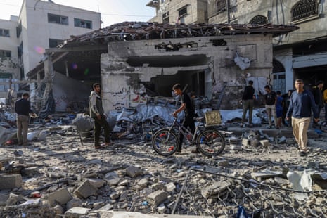 Palestinians inspect a destroyed building after an Israeli airstrike in al-Nasr street in Gaza City, northern Gaza Strip, on Thursday.