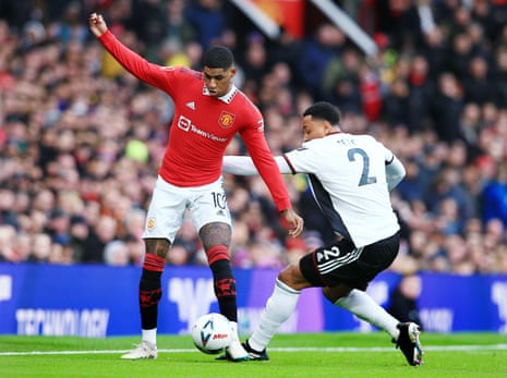 Marcus Rashford of Manchester United and Kenny Tete of Fulham in action.