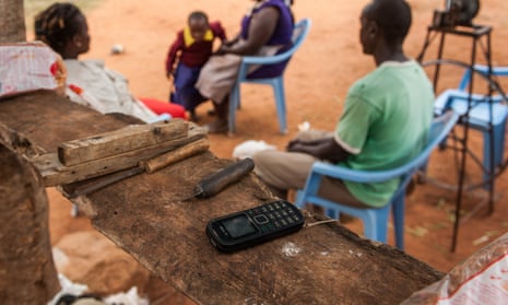 A mobile phone is charged using M-Kopa solar technology in Kenya