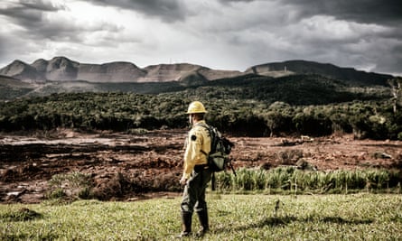 Denis Valerio, volunteer rescue worker, looks at the disaster zone near Corrégo de Feijão.