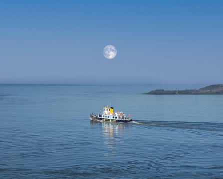 The little Cremyll foot ferry sets sail in moonlight across the Hamoaze estuary to Plymouth.