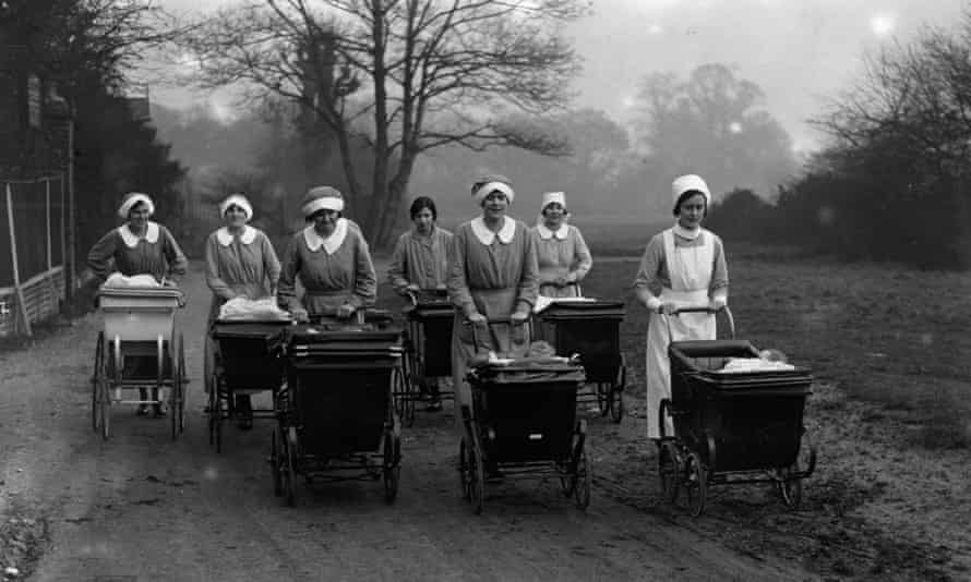 seven women pushing babies in prams in the countryside in 1926