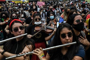 Musicians take part in a protest in Medellín