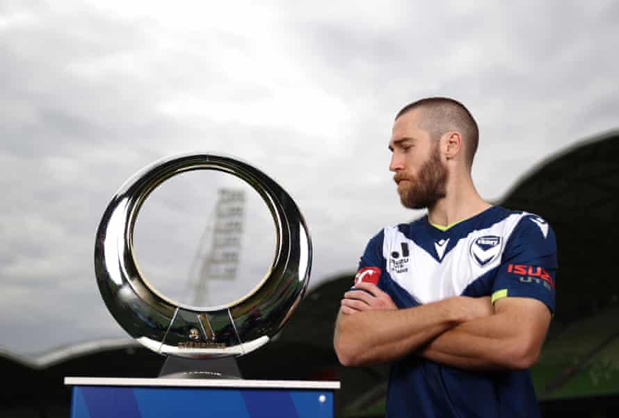 Josh Brilliante gets a close look at the ‘toilet seat’, the A-League Men’s trophy.