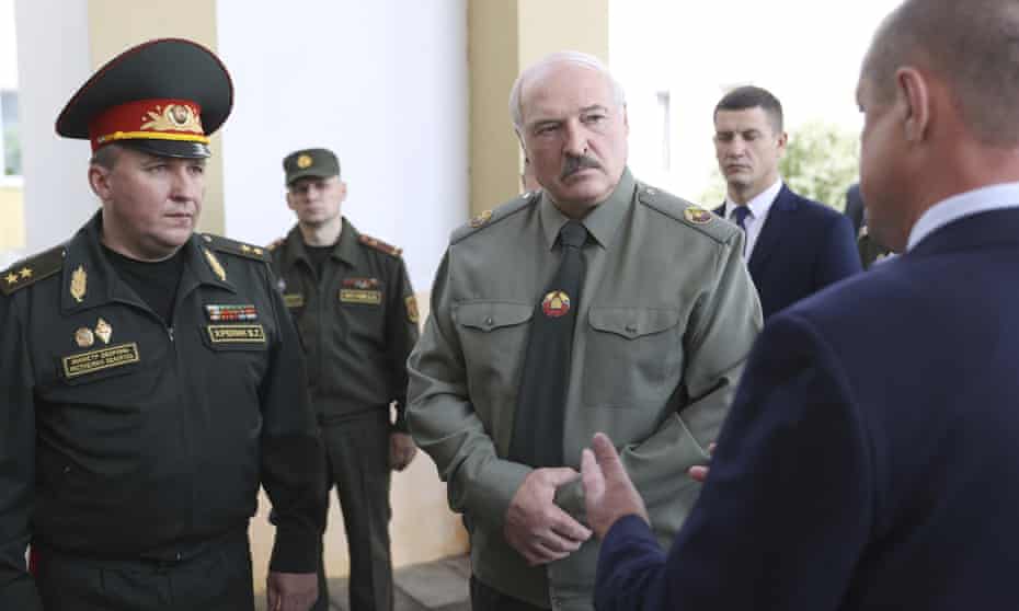 Belarusian president, Alexander Lukashenko (centre), attends a defence meeting in  Shklov